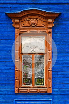 Brown platband on blue wall in Arzamas