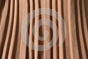 Brown pleat fabric background is a beautiful curved wave.