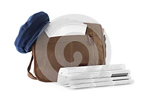 Brown postman bag with mails, newspapers and hat on white background