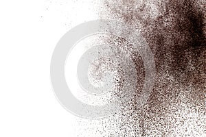 Brown powder dust cloud.Brown particles splattered on white background