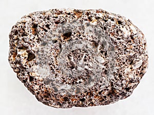 brown pumice stone on white marble background