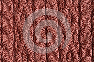 Brown-red acrilic knitted fabric texture. Macro