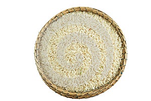 Brown rice on basket isolate on white