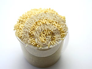 Brown rice or coarse rice from Thailand on a white background.