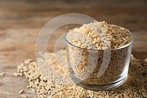 Brown rice in glass on table