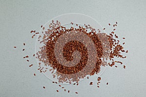 Brown rice is scattered on the table. GABA rice, top view, place for text