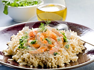 Brown rice with shrimp and arugula photo