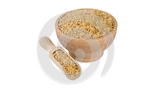Brown rice in wooden bowl and scoop isolated on white background. nutrition. bio. natural food ingredient