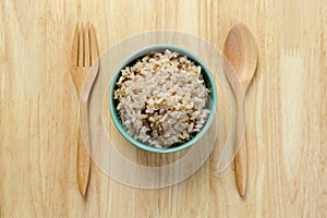 Brown Rice on Wooden Table