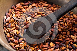 Brown roasted cocoa beans. Background, the process of making cocoa