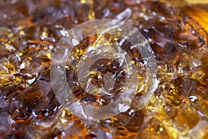 Brown rosin for soldering in a jar, background