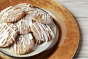 Brown Round Christmas Gingerbread cookies drizzled with White Ch