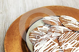 Brown Round Christmas Gingerbread cookies drizzled with White Ch