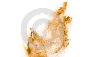 Brown sand explosion isolated on white background. Abstract sand cloud backdrop