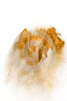 Brown sand explosion isolated on white background. Abstract sand cloud backdrop