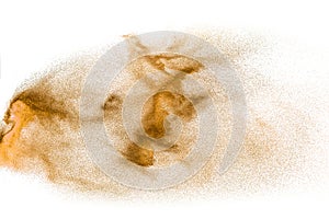 Brown sand explosion isolated on white background. Abstract sand cloud backdrop