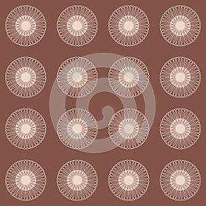 Brown seamless pattern with round wheel ornament for clothing design