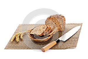 Brown seed bio bread isolated on white background