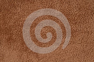 Brown sherpa textured plush fabric material background