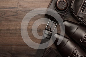 Brown shoes, belt, socks and film camera