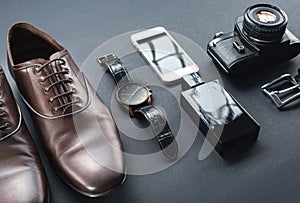 Brown shoes, film camera, telephone, clock, parfume