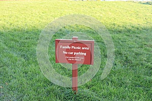 Brown signboard showing family picnic area - family bonding space