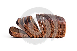 Brown sliced loaf of rye Borodino bread on a white