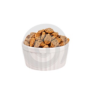 Brown sliced rye bread as croutons in white ceramics bowl isolated on white background.