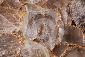 Brown smoky quartz stone slab. Gemstone background. photo