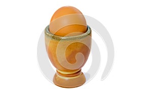 Brown soft boiled egg in the eggcup.