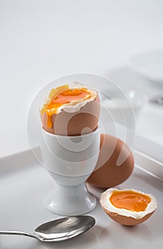Brown soft-boiled open egg for breakfast