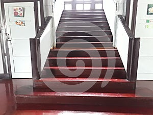 Brown stairway up the second floor, office building