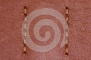 Brown stitched leather close up