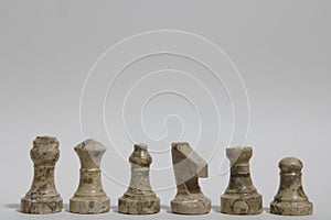 Brown stone chess piece lineup