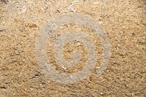 brown stone wall with rough surface - background