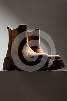 brown suede boots. fashion female shoes still life