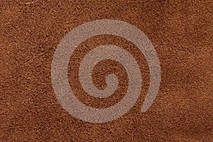Brown suede texture background, closeup