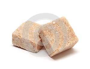 Brown sugar cube isolated on white background