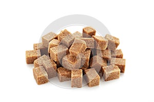 Brown sugar cubes isolated on white background