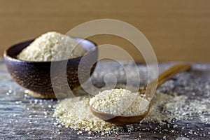 brown sugar heap and wooden spoon