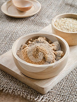 Brown sugar and wheat germ in wooden bowl