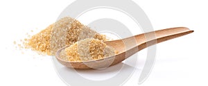 Brown sugar in wood spoon on white background
