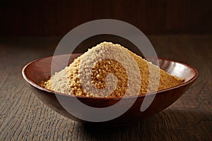 Brown sugar in a wooden bowl