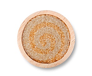 Brown sugar in wooden bowl on white background. Top view