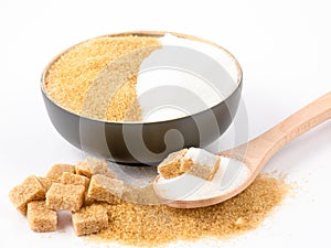 Brown sugar in a wooden bowl or wooden spoon Sugar for health Use for cooking or desserts on white and sugar backgrounds