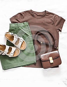 Brown t-shirt, green cotton bermudas, leather sandals, cross body bag - set of women\'s comfortable clothing