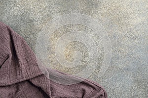 Brown tablecloth on concrete