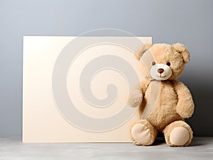 brown teddy bear with a blank sign with space for copy