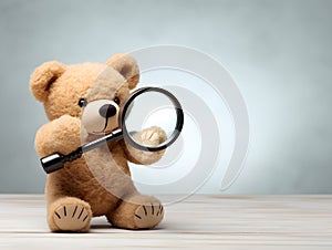 brown teddy bear with a blank sign with space for copy