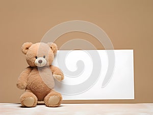 brown teddy bear with a blank sign with space for copy